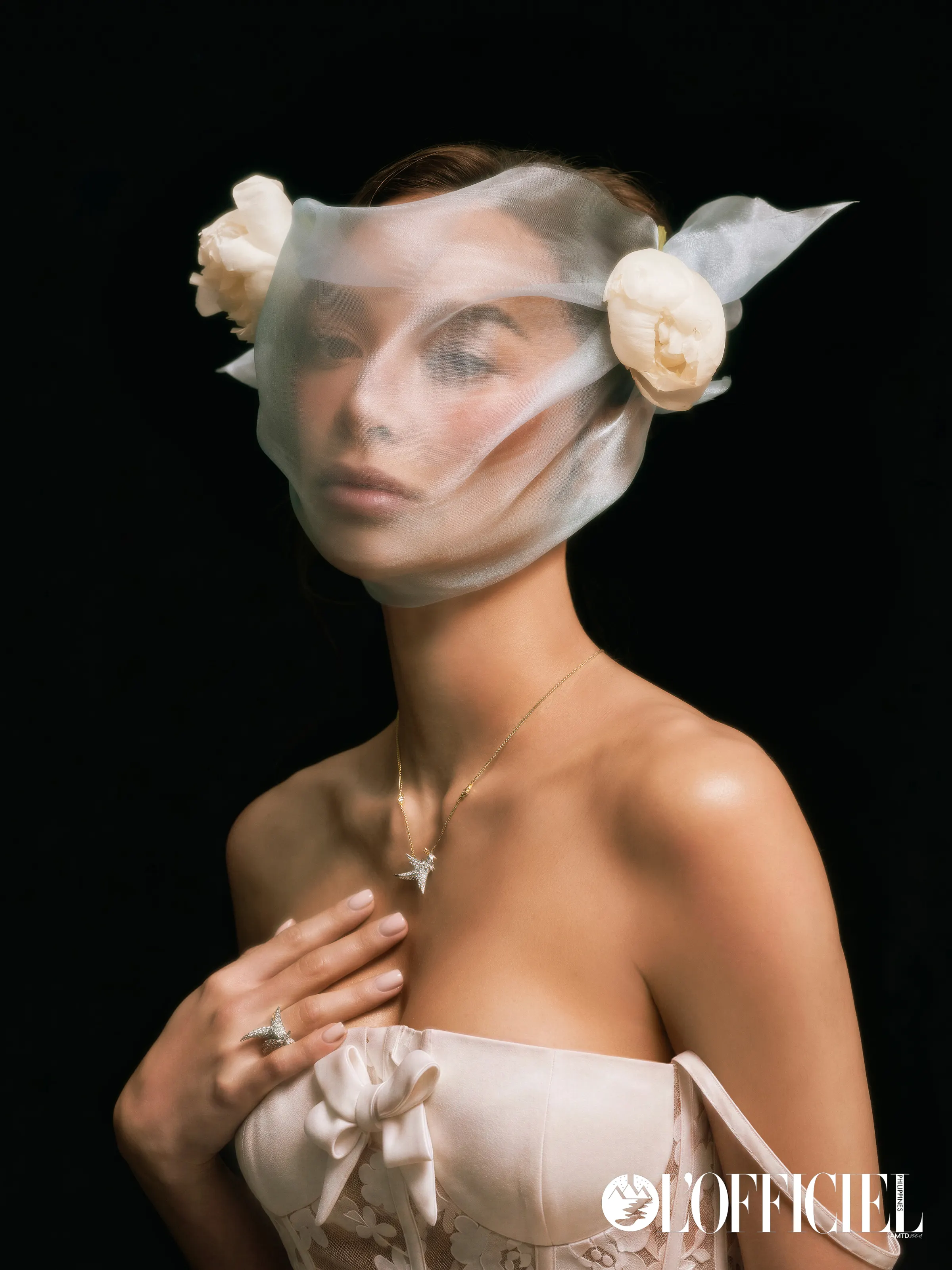 Veiled portrait of Kylie Verzosa with white roses, photographed for L'OFFICIEL
